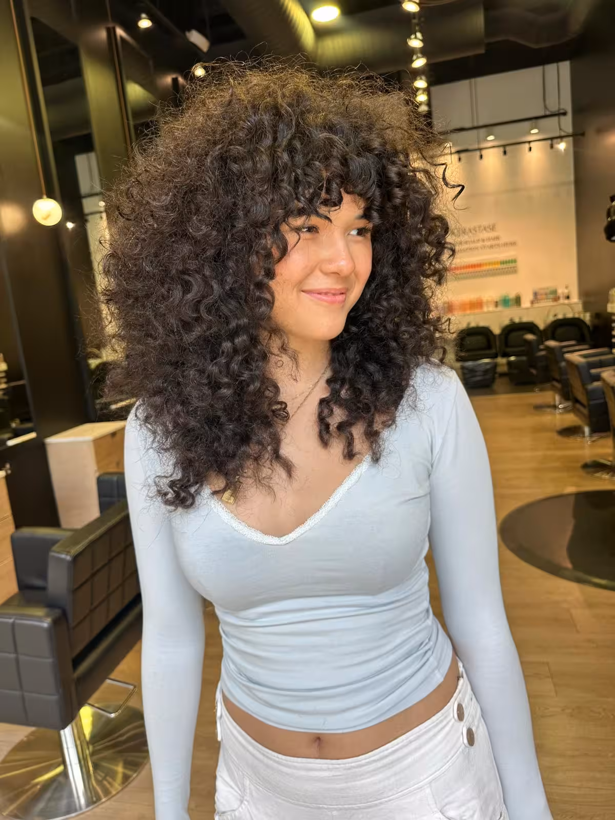Voluminous long curly hair with curtain bangs - curly hair styling Honolulu